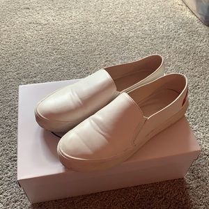 Lulus white slip on sneakers with kiss on back